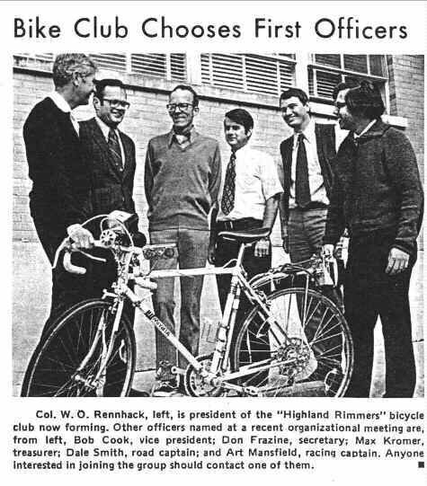 1974 newspaper clipping headlined 'Bike Club Chooses First Officers.' Six men stand behind a ten-speed bicycle. Caption: Col. W. O. Rennhack, left, is president of the 'Highland Rimmers' bicycle club now forming. Other officers named at a recent organizational meeting are, from left, Bob Cook (printed in error for Bob Crook), vice president; Don Frazine, secretary; Max Kromer, treasurer; Dale Smith, road captain; and Art Mansfield, racing captain. Anyone interested in joining the group should contact one of them.